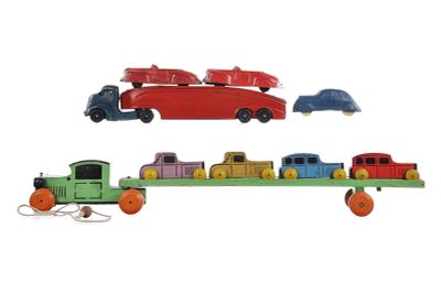 (2) Strombecker & Auburn Rubber Car Carriers. A set of car carriers. One is an Auburn Rubber car 