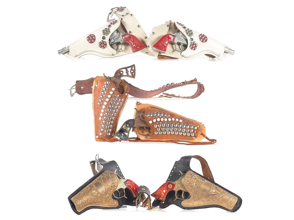Lot 425: Texan, Cowboy 44, Bronco, Lone Ranger Cap Guns & Holsters
