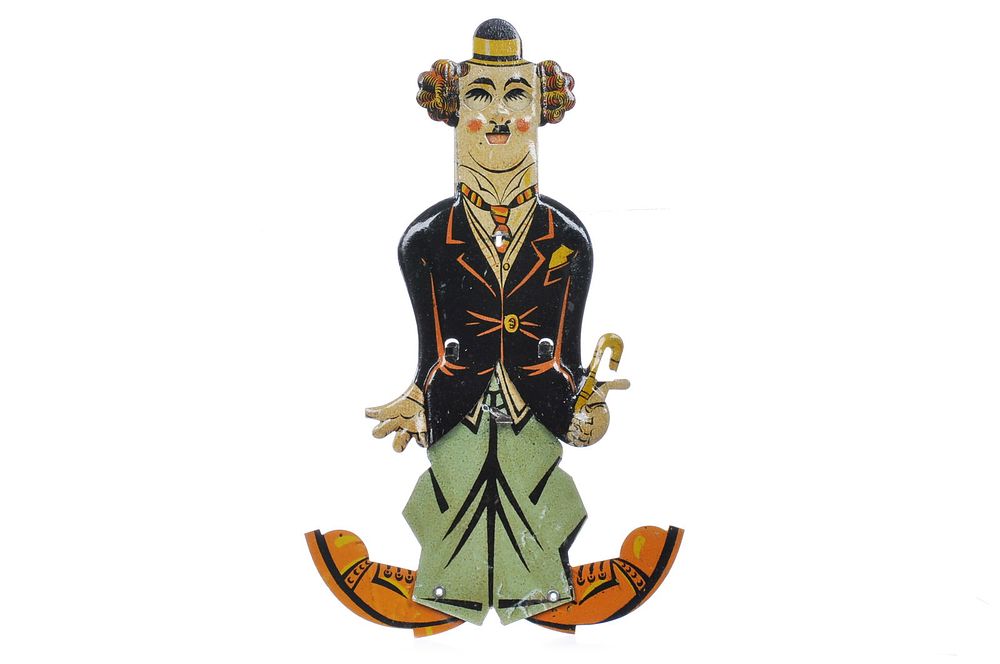 Lot 510: German Tin Charlie Chaplin Squeeze Toy