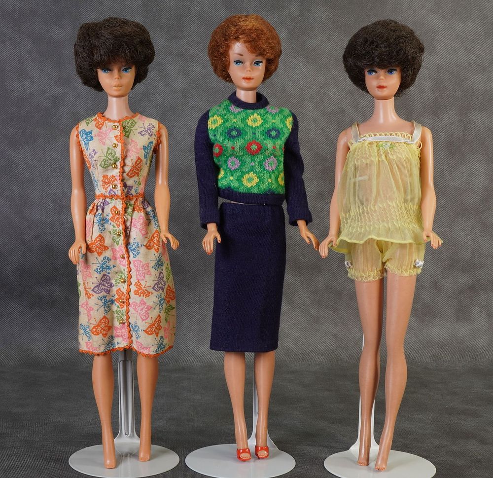 Lot 161: Two Vintage Brunette and One Titian Bubble Cut Barbie Dolls