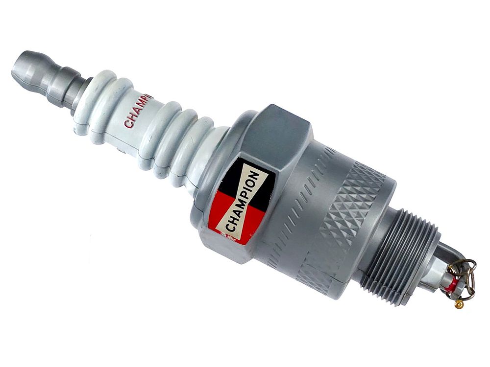 Lot 259: Oversized Champion Spark Plugs Advertising Sign 22"