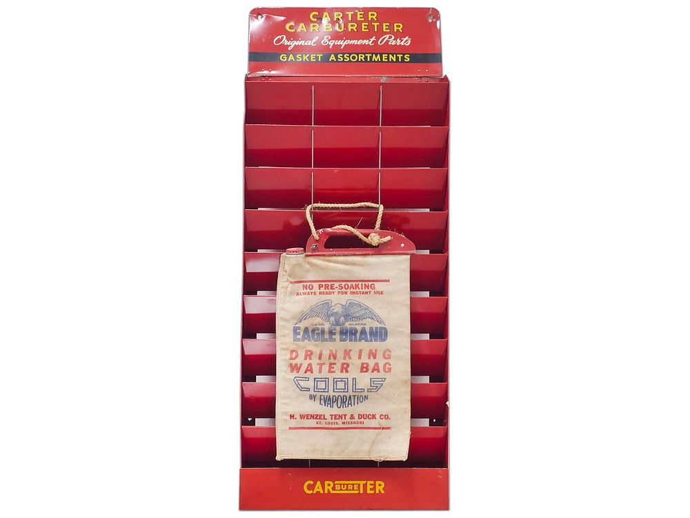 Lot 295: Steel Carter Carbureter's Display Stand & Eagle Brand Drinking Water Bag