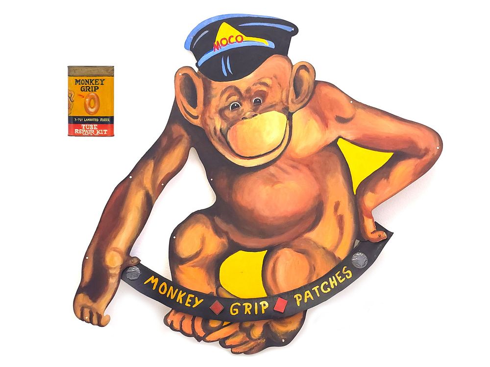 Lot 509: Moco Monkey Grip Tire Patches Hand-Painted Steel Sign