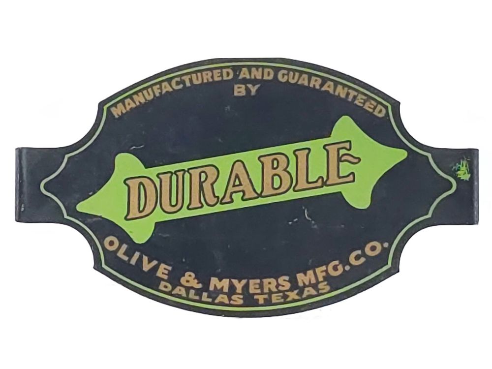 Lot 708: Durable Olive & Myers Tin Advertising Badge