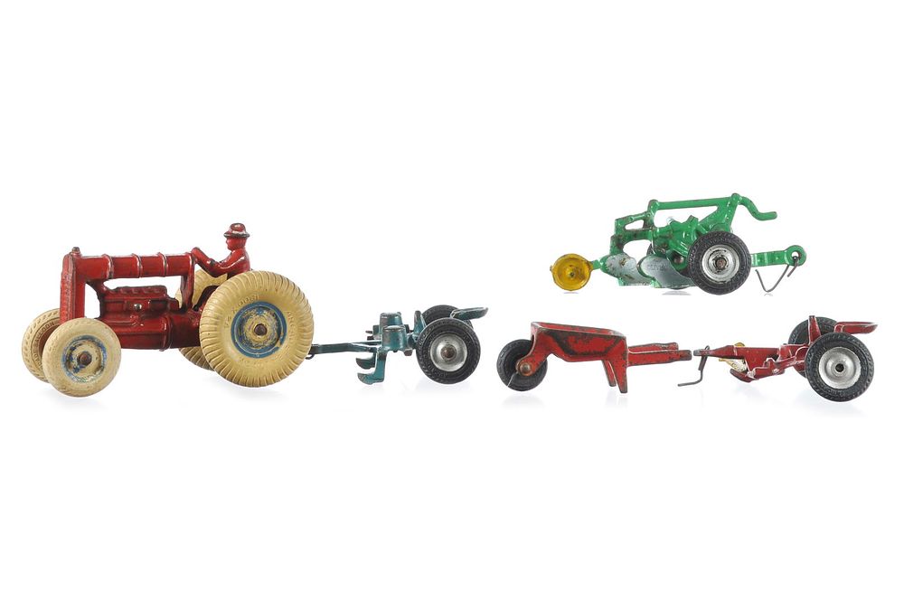 Lot 158: Arcade Cast Iron Tractor and 4 Implement Set
