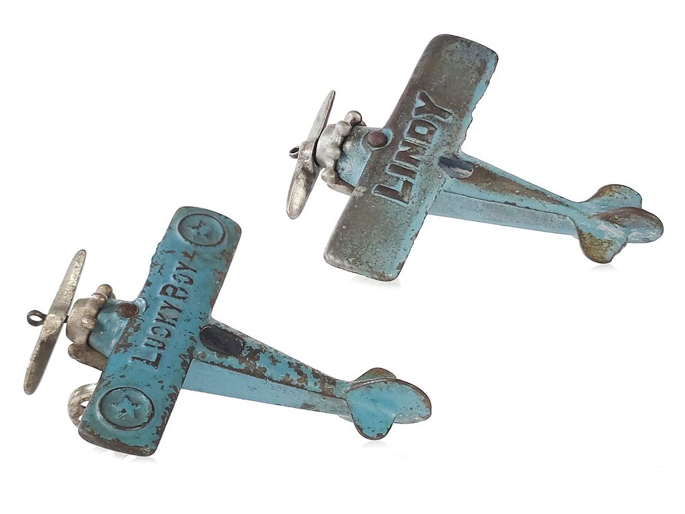 Lot 201: (2) Hubley Lindy Plane and Dent Lucky Boy Cast Iron Aircraft