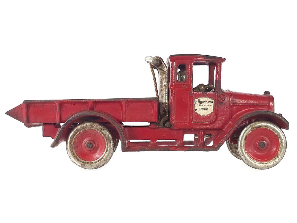 Lot 232: Large I.H. Cast Iron Red Baby Dump Truck