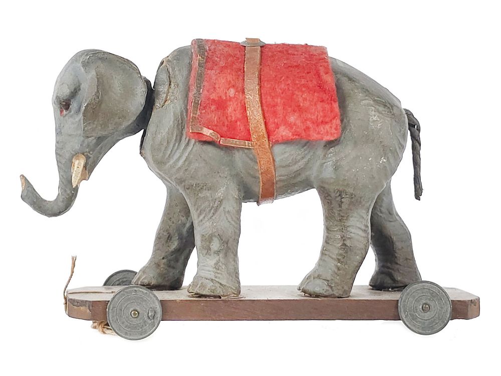 Lot 257: Composite Elephant on Platform Head Nodder Pull Toy