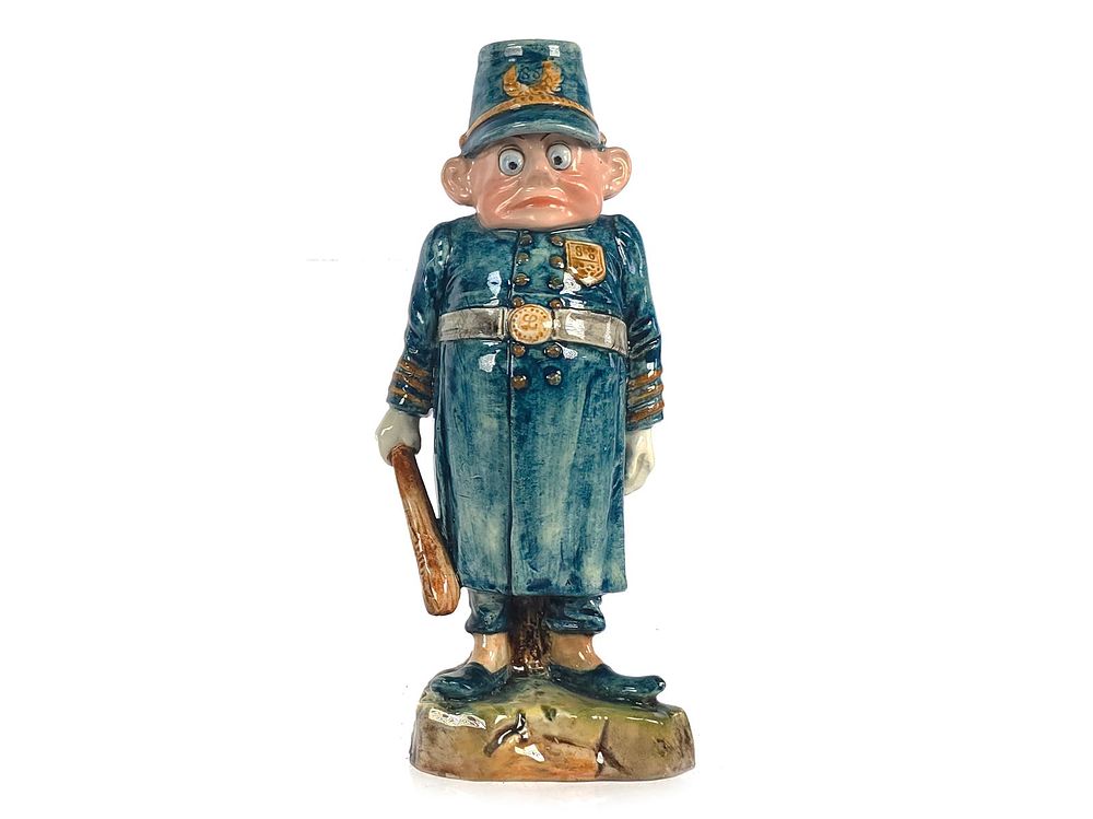 Lot 278: Majolica Palmer Cox Brownie Policeman Candlestick