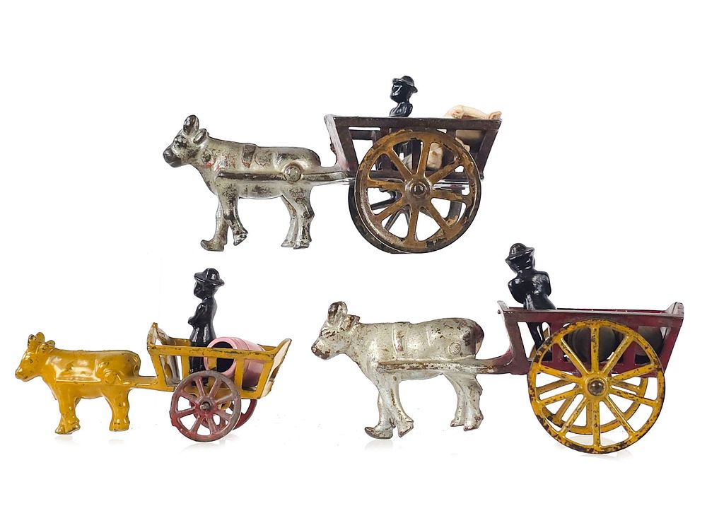 Lot 312: Trio of Cow-Drawn Hay Carts by Hubley and Shimer