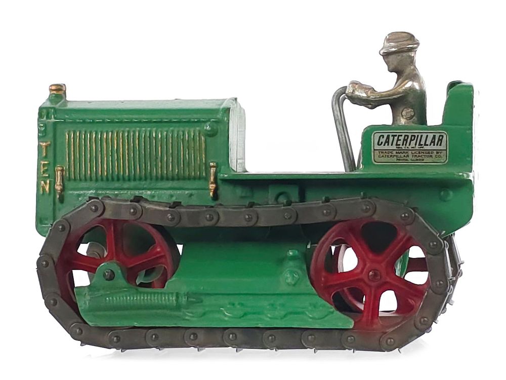 Lot 330: Green Arcade Toys Caterpillar Tractor with Plated Cast Iron Driver