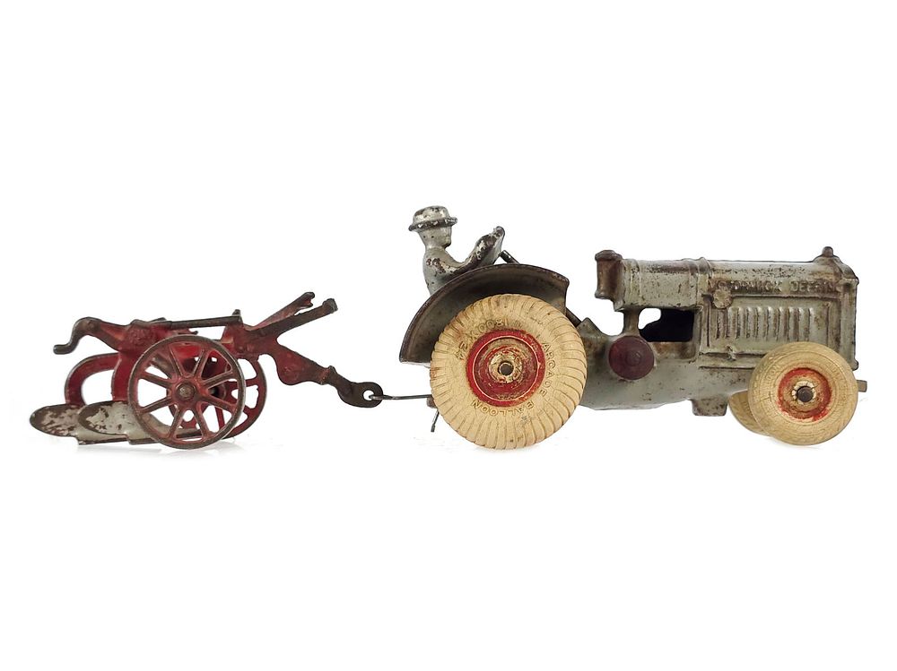 Lot 376: Arcade McCormick-Deering Cast Iron Tractor and Plow