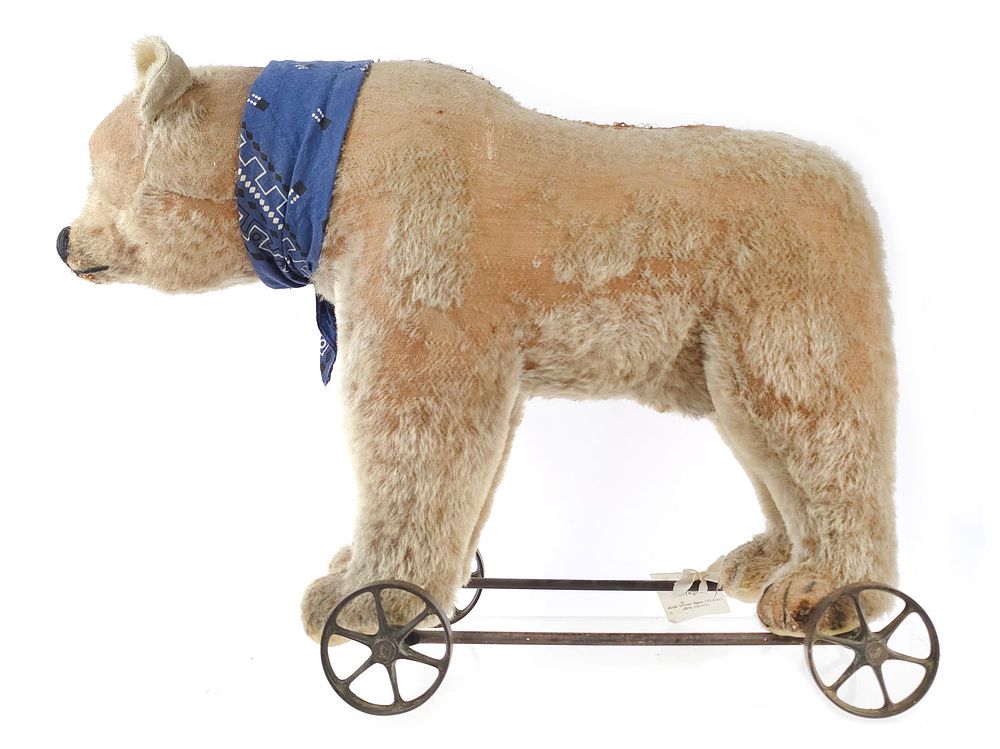 Lot 295: Large White Steiff Bear on Iron Wheels