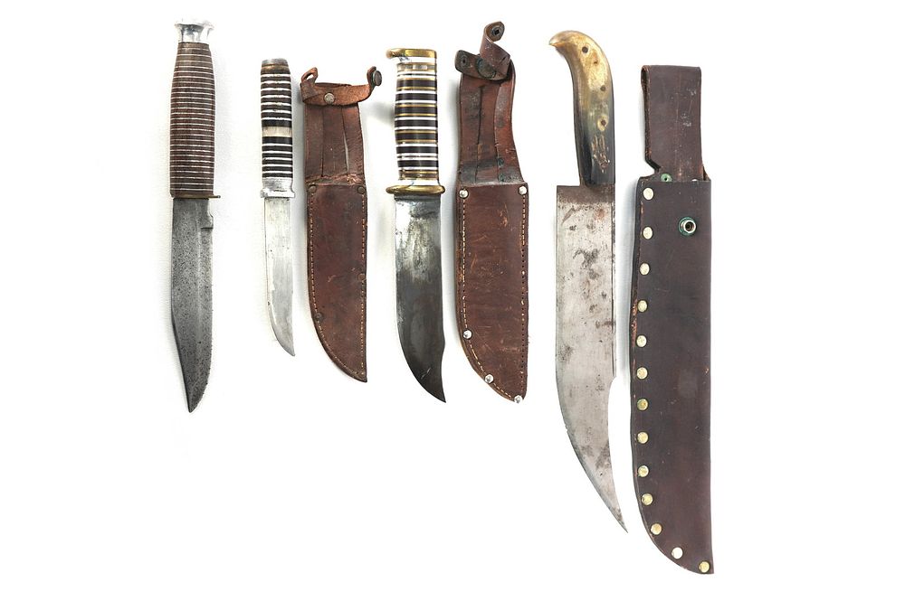 Lot 242: (4) WWII Theater Knives Bone/Wood/Brass/Aluminum Handles Including Sheaths