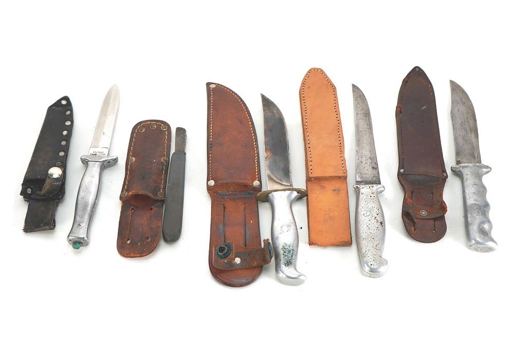 Lot 255: (5) WWII Theater Knives Aluminum/Brass/Rubber Handles Including Sheaths