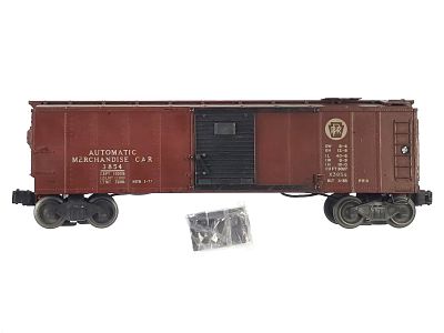 Lionel 3854 Operating Merchandise Car. A Lionel 3854 operating merchandise car with bagged 