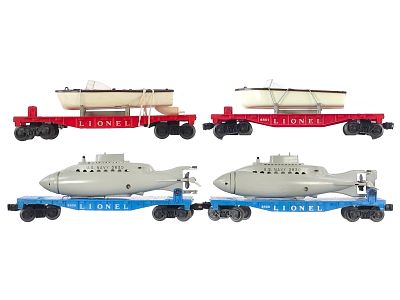 (4) Lionel Assorted Flat Cars w/Navy Submarines & Boats. A lot of four Lionel flat cars with 