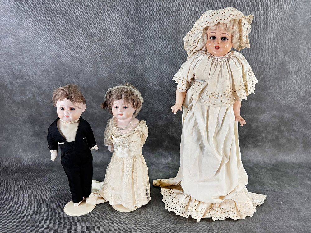 Lot 393: Antique Wax Composition Crier Doll & Bride and Groom Patent Washable Dolls