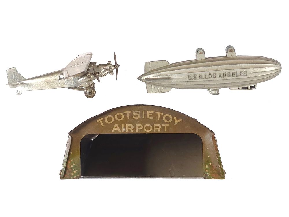 Lot 191: (3) Tootsietoy Very Rare Plane, Blimp & Airport Hangar