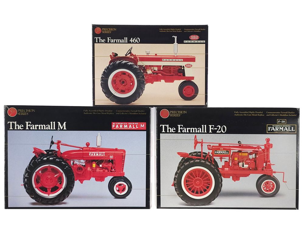 Lot 311: (3) Ertl Precision Series Farmall Tractors 460, F-20 & M NMIB