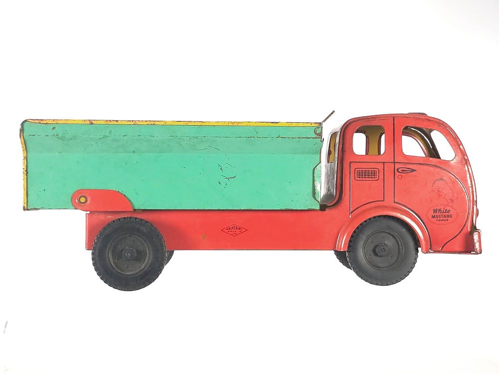 Lot 303: Wolverine White Mustang Power Dump Truck Pressed Steel