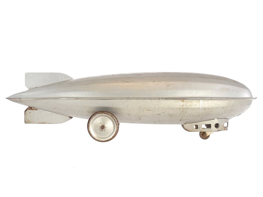 Lot 314: Steelcraft Pressed Steel Silver Zeppelin Pull Toy