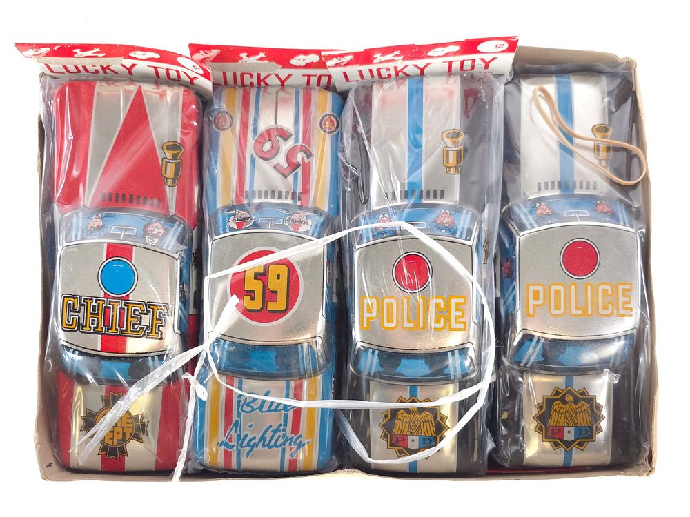 Lot 411: Lucky Toy Tin Police Cars, Fire Chief & #59 Blue Lightning Case