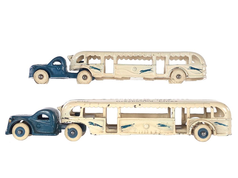 Lot 421: (2) Arcade Toys GMC Bus Cast Iron