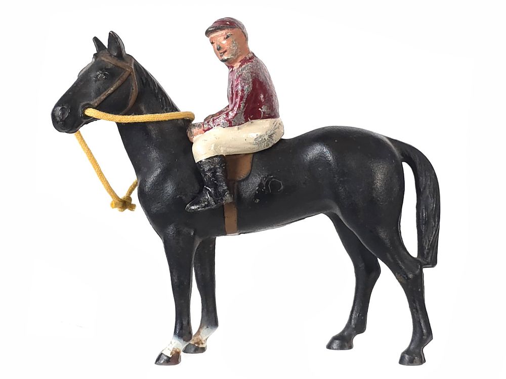 Lot 480: Hubley Black Horse/Thoroughbred with Red & White Jockey Cast Iron