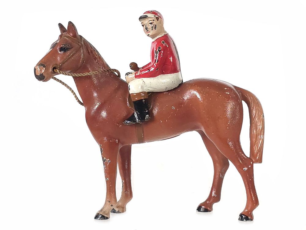 Lot 481: Hubley Brown Horse with Cream & Red Jockey