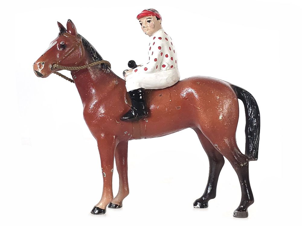 Lot 486: Hubley Caramel Thoroughbred Horse with White & Red Polka Dot Jockey