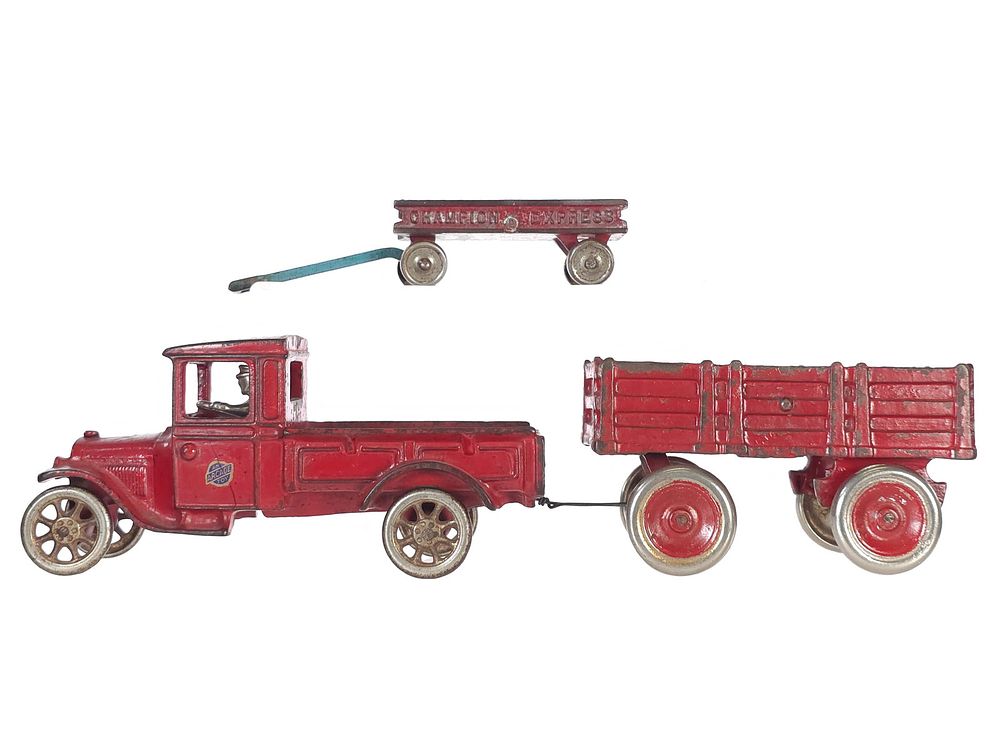 Lot 487: (2) Arcade Truck & Trailer & Champion Express Wagon Cast Iron