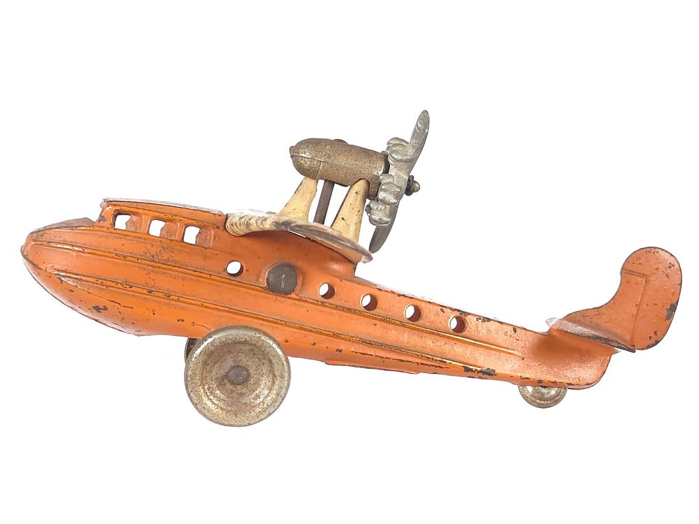 Lot 579: Kilgore Sea Gull Orange Cast Iron Plane