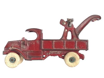 Champion Tow Truck Cast Iron. An original red Champion cast iron Tow Truck features blue rims 
