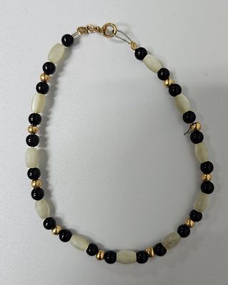 צמיד מזהב 14 קראט משולב פנינים ואוניקס אורך הצמיד 18 ס"מ , פריט זה הגיע מחו"ל