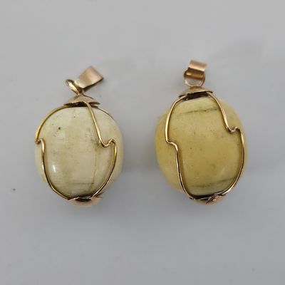 זוג עגילים מזהב 14 קראט משולבים ענבר/בקלית במשקל 16.5 גרם , 
קוטר הכדור 2 ס"מ