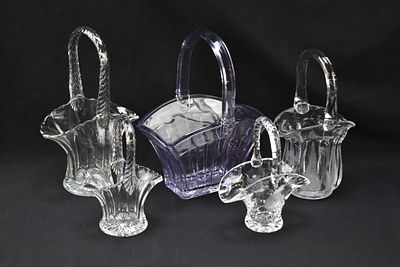 COLLECTION OF HEISEY GLASS AND DUNCAN & MILLER GLASS BASKETS. A collection of five Heisey Glass 