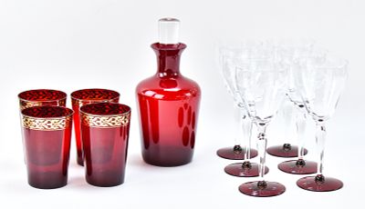 COLLECTION OF ASSORTED RUBY RED GLASS BARWARE. A collection of assorted ruby red glass barware 