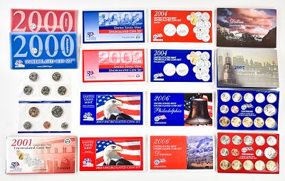 2000s UNCIRCULATED UNITED STATES MINT SETS. A collection of sixteen uncirculated coin sets from 