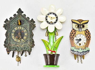 VINTAGE MINIATURE WALL CLOCKS. An assortment of three vintage miniature wall clocks including a 