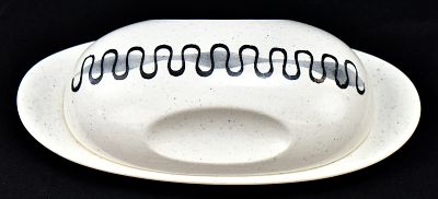 METLOX POPPY TRAIL "AZTEC" PATTERN BUTTER DISH. A Metlox Poppy Trail "Aztec" pattern butter dish 