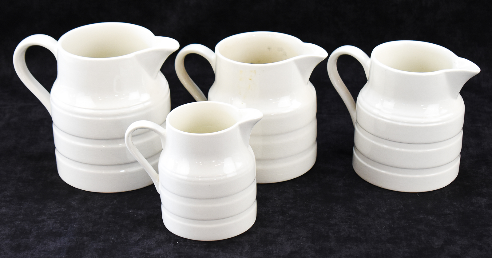 FOUR LORD NELSON POTTERY ENGLISH WHITE IRONSTONE PITCHERS