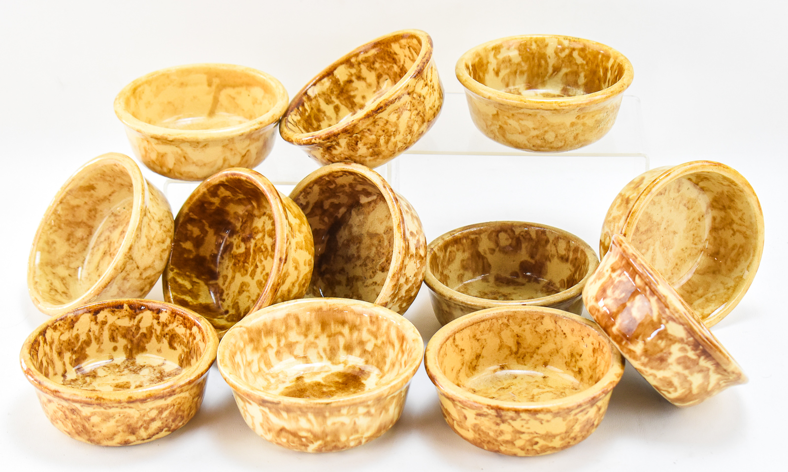 TWELVE AMERICAN YELLOW WARE ROCKINGHAM-STYLE SPONGE WARE BOWLS