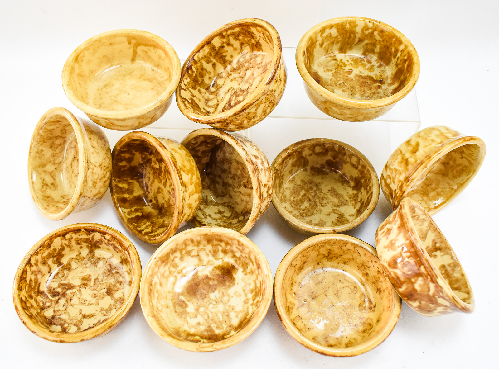 TWELVE AMERICAN YELLOW WARE ROCKINGHAM-STYLE SPONGE WARE BOWLS
