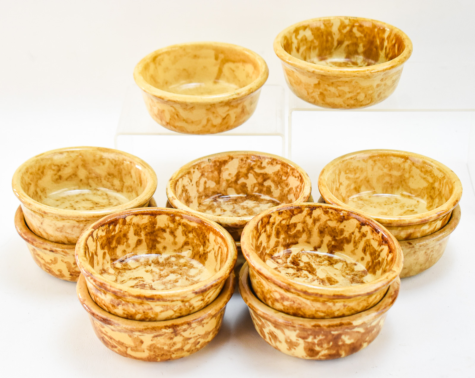 TWELVE AMERICAN YELLOW WARE ROCKINGHAM-STYLE SPONGE WARE BOWLS