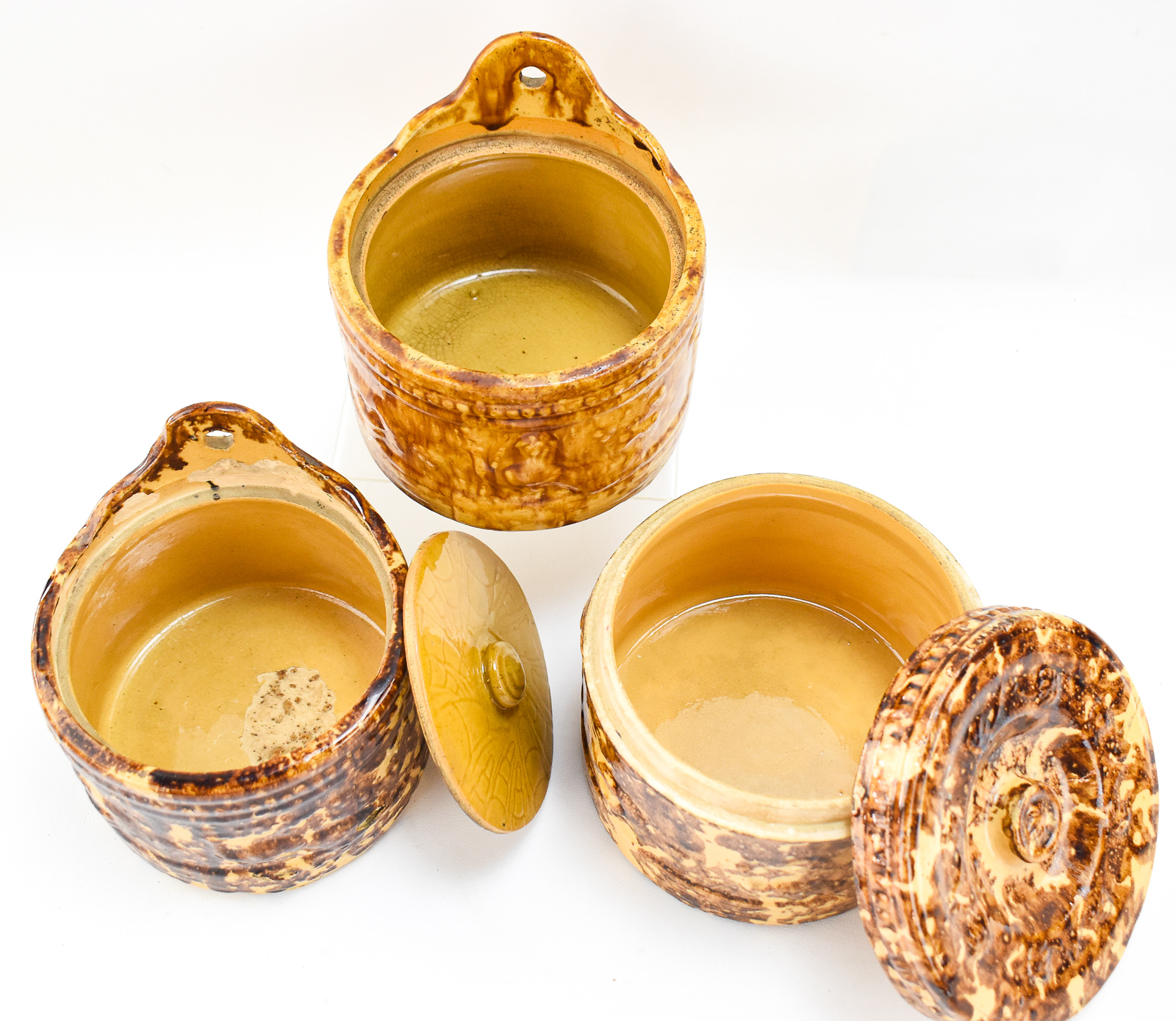 ROCKINGHAM-GLAZED SPONGE WARE SALT CELLARS AND COVERED JAR