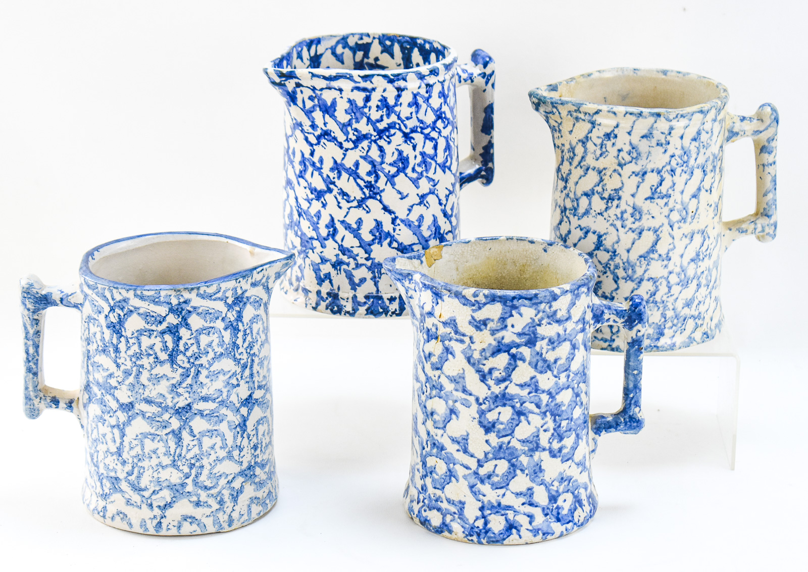 FOUR AMERICAN SPONGEWARE PITCHERS