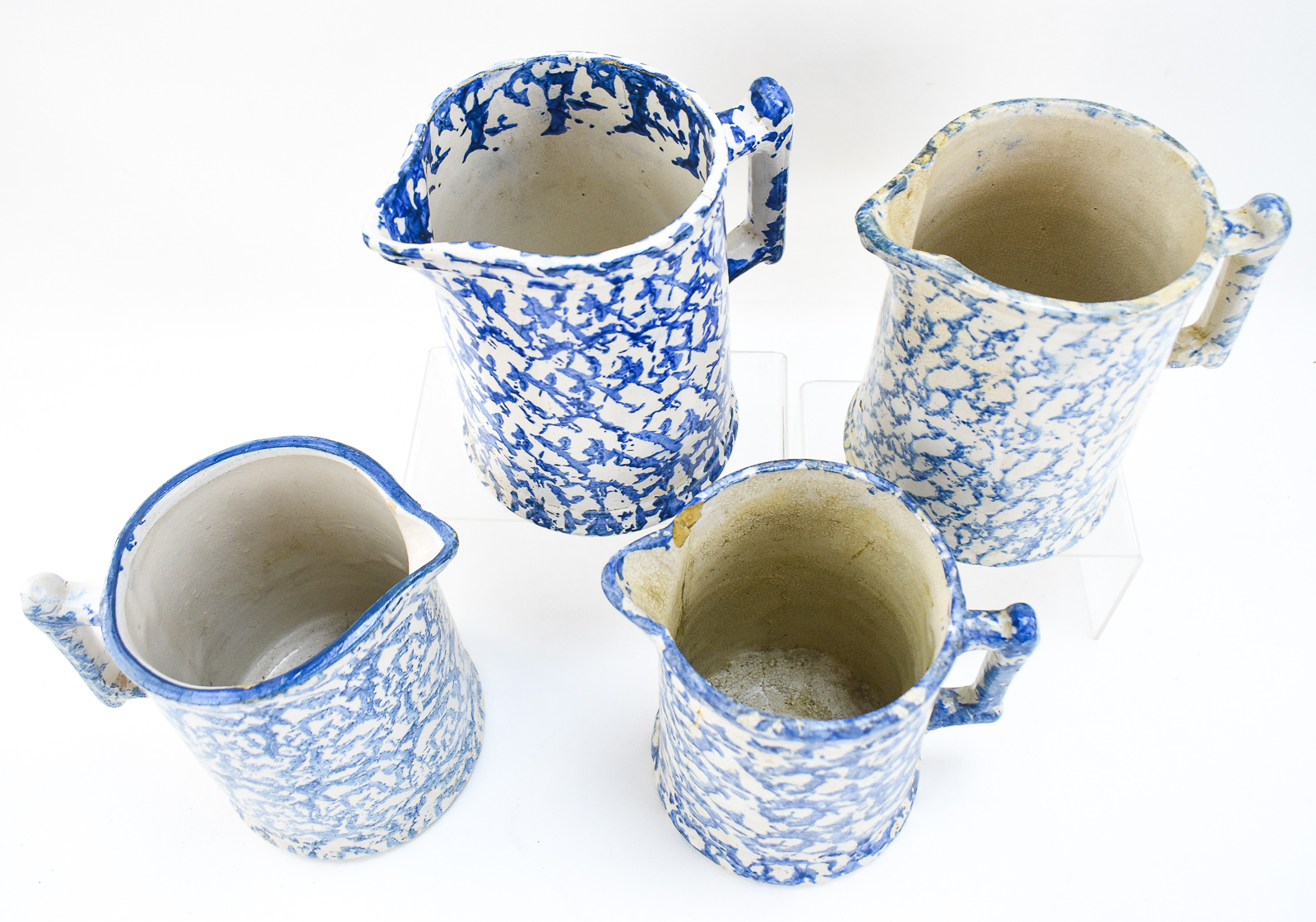 FOUR AMERICAN SPONGEWARE PITCHERS