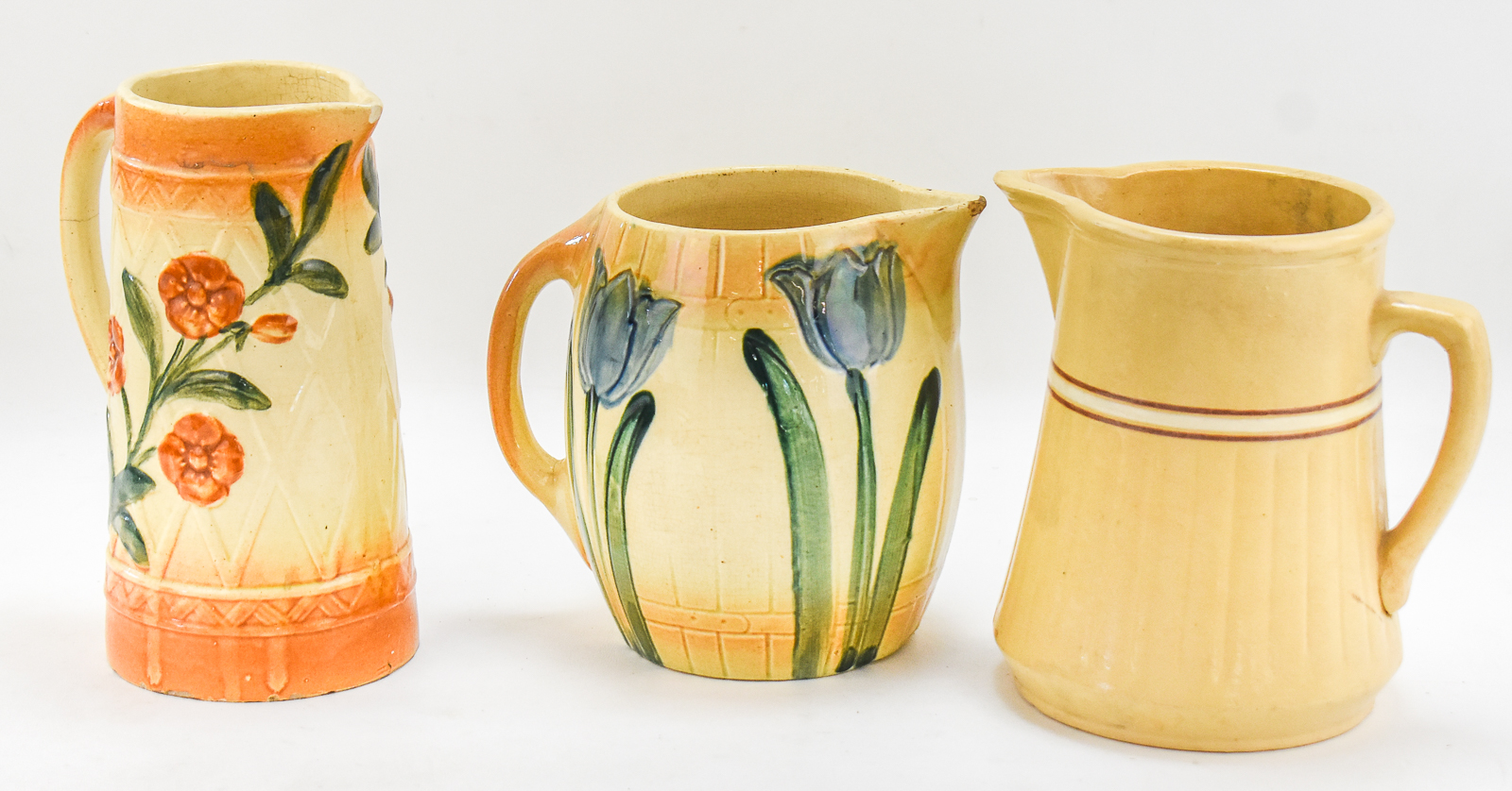 MID CENTURY PITCHERS: ROSEVILLE "TULIPS", "WILD ROSES", AND RED WING SAFFRON WARE