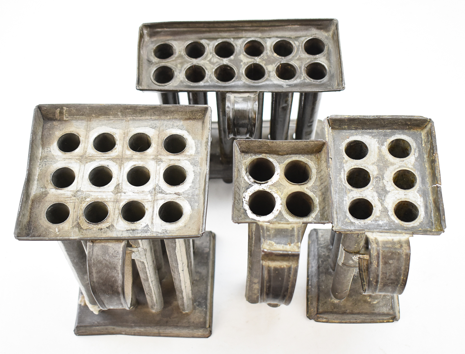 COLLECTION OF FOUR AMERICAN TAPER CANDLE MOLDS